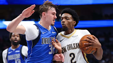 Nov 5, 2025; Dallas, Texas, USA;  New Orleans Pelicans forward Herbert Jones (2) drives to the basket as Dallas Mavericks forward Cooper Flagg (32) defends during the first half at American Airlines Center. Mandatory Credit: Kevin Jairaj-Imagn Images