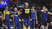 May 4, 2025; Houston, Texas, USA; Golden State Warriors bench players celebrate after a basket by guard Buddy Hield (not pictured) during the second quarter of game seven of the first round for the 2025 NBA Playoffs against the Houston Rockets  at Toyota Center. Mandatory Credit: Troy Taormina-Imagn Images
