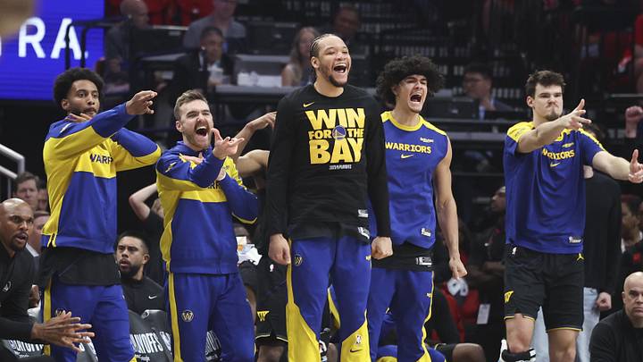 May 4, 2025; Houston, Texas, USA; Golden State Warriors bench players celebrate after a basket by guard Buddy Hield (not pictured) during the second quarter of game seven of the first round for the 2025 NBA Playoffs against the Houston Rockets  at Toyota Center. Mandatory Credit: Troy Taormina-Imagn Images