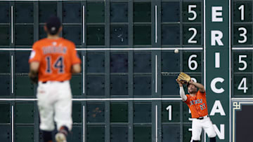 Jul 12, 2025; Houston, Texas, USA; Houston Astros left fielder Jose Altuve (27) catches a Texas Rangers fly ball for an out  in the seventh  inning at Daikin Park. Mandatory Credit: Thomas Shea-Imagn Image
