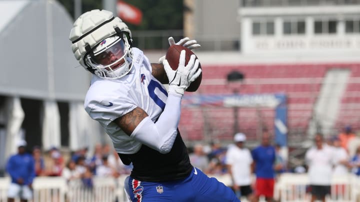 Bills wide receiver Keon Coleman pulls in a pass close to the sideline.