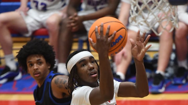 Riverside played Byrnes in high school boys' basketball at Riverside High School on Feb. 14, 2025. Riverside won the game 63-52. Riverside's Rickey Lassiter (21) with the ball on a play. Riverside played Byrnes in high school boys' basketball at Riverside High School on Feb. 14, 2025. Riverside won the game 63-52. Riverside's Rickey Lassiter (21) with the ball on a play.