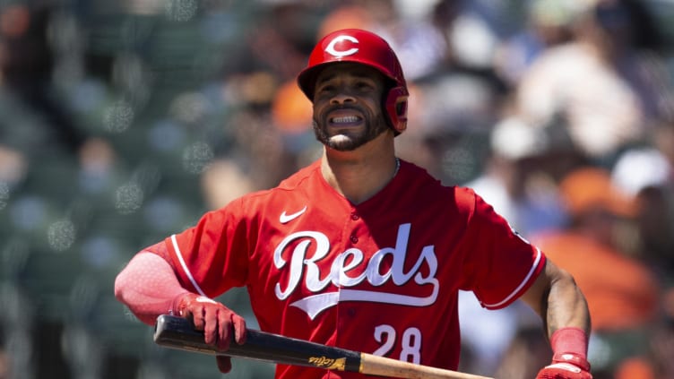 Cincinnati Reds left fielder Tommy Pham (28) reacts.