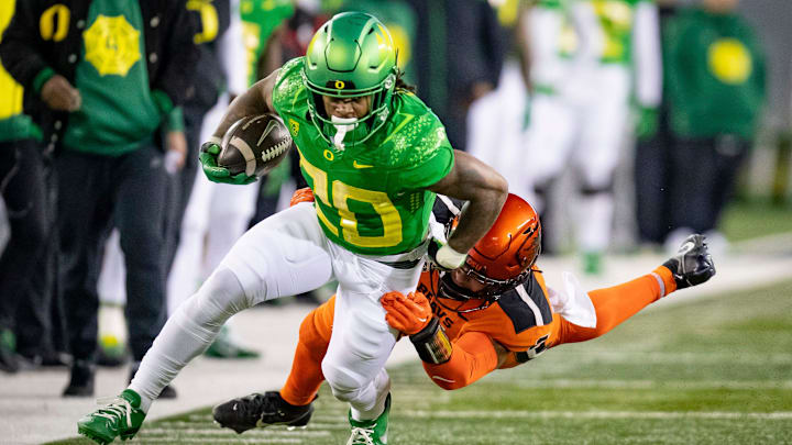 Oregon running back Jordan James carries the ball as the Ducks take on the Oregon State Beavers.