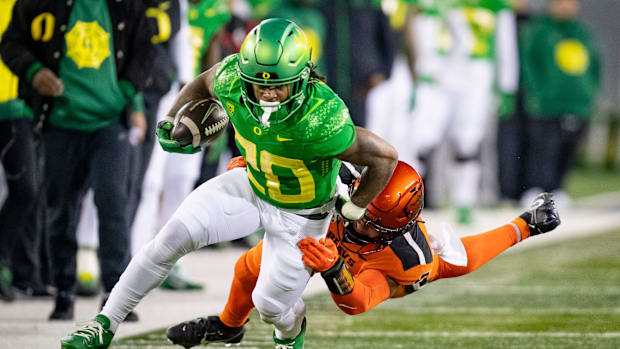 Oregon running back Jordan James carries the ball as the No. 6 Oregon Ducks take on the No. 16 Oregon State Beavers Friday, N