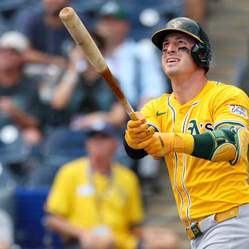 Jul 2, 2025; Tampa, Florida, USA; Athletics right fielder Brent Rooker (25) hits a home run against the Tampa Bay Rays in the first inning at George M. Steinbrenner Field. Mandatory Credit: Nathan Ray Seebeck-Imagn Images