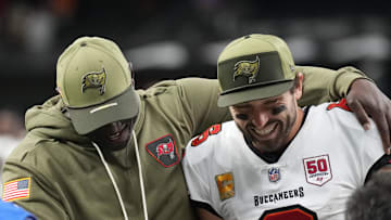 Tampa Bay Buccaneers head coach Todd Bowles and quarterback Baker Mayfield (6) celebrate a win over the New Orleans Saints