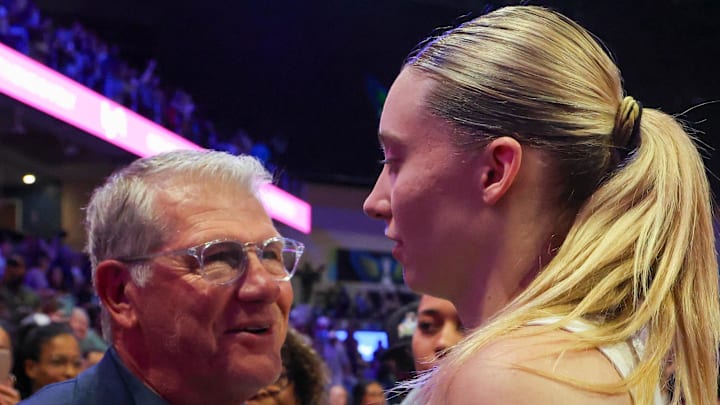 University of Connecticut head coach Geno Auriemma speaks with Dallas Wings guard Paige Bueckers. University of Connecticut head coach Geno Auriemma speaks with Dallas Wings guard Paige Bueckers.