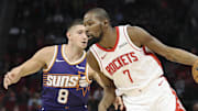 Dec 5, 2025; Houston, Texas, USA; Houston Rockets forward Kevin Durant (7) attempts to dribble past Phoenix Suns guard Grayson Allen (8) during the first quarter at Toyota Center. Mandatory Credit: Troy Taormina-Imagn Images