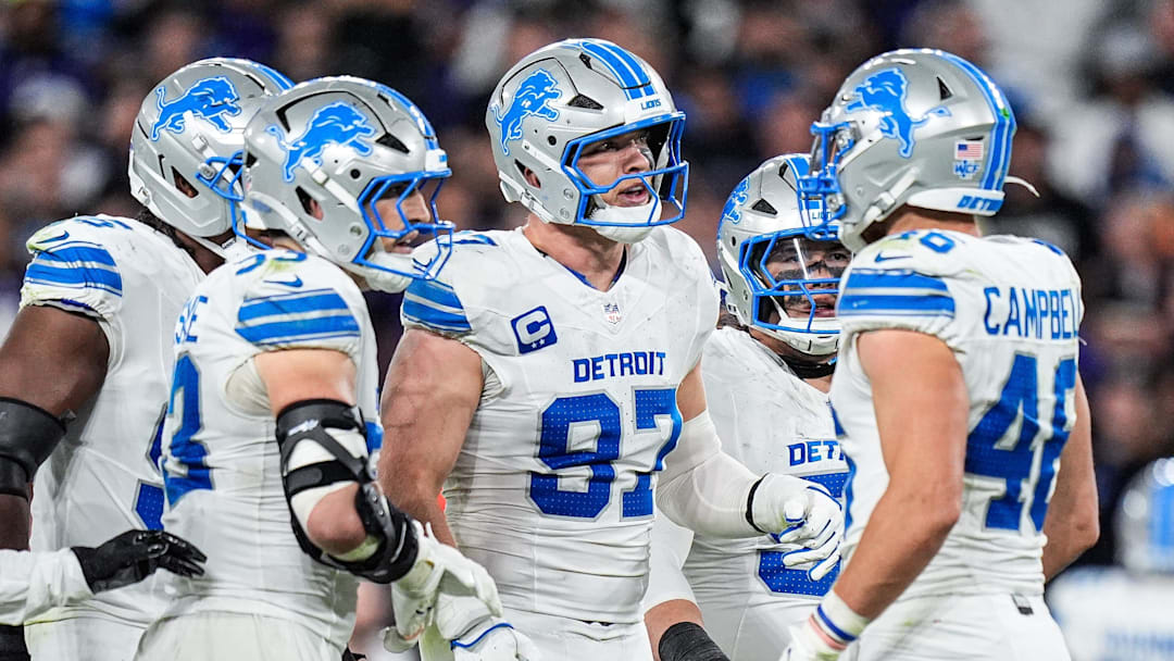 Detroit Lions defensive end Aidan Hutchinson (97), center, talks to teammates before a play against Baltimore Ravens during the second half at M&T Bank Stadium in Baltimore, Md. on Monday, Sept. 22, 2025.