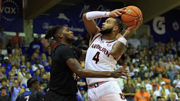 Nov 27, 2024; Lahaina, Hawaii, USA;  Auburn Tigers forward Johni Broome (4) shoots over Memphis Tigers forward Dain Dainja (42) in the first half at Lahaina Civic Center. Mandatory Credit: Marco Garcia-Imagn Images