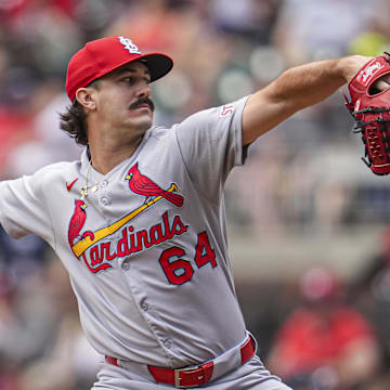 Apr 23, 2025; Cumberland, Georgia, USA; St. Louis Cardinals pitcher Ryan Fernandez (64) pitches against the Atlanta Braves during the eighth inning at Truist Park. Mandatory Credit: Dale Zanine-Imagn Images