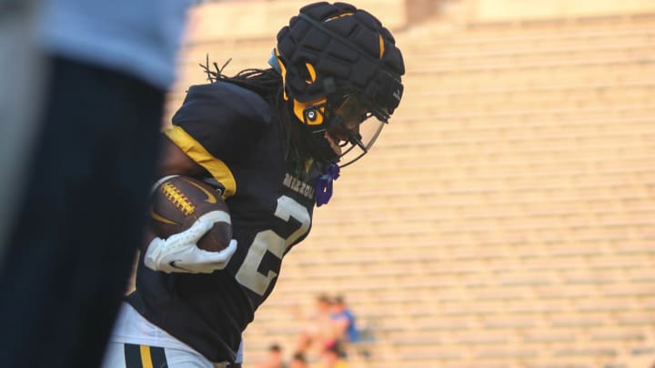 Aug 17, 2024; Columbia, Missouri USA; Missouri Tigers wide receiver (16) handles the ball at the team's open practice at Faurot Field. 