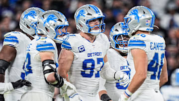 Detroit Lions defensive end Aidan Hutchinson (97), center, talks to teammates before a play against Baltimore Ravens during the second half at M&T Bank Stadium in Baltimore, Md. on Monday, Sept. 22, 2025.