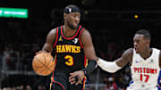 Feb 23, 2025; Atlanta, Georgia, USA; Atlanta Hawks guard Caris LeVert (3) dribbles the ball down the court against Detroit Pistons guard Dennis Schroder (17) during the third quarter at State Farm Arena. Mandatory Credit: Jordan Godfree-Imagn Images