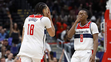 Oct 30, 2024; Washington, District of Columbia, USA; Washington Wizards forward Kyshawn George (18) celebrates with Wizards guard Carlton Carrington (8) after a three point field goal against the Atlanta Hawks in the second half at Capital One Arena. Mandatory Credit: Geoff Burke-Imagn Images