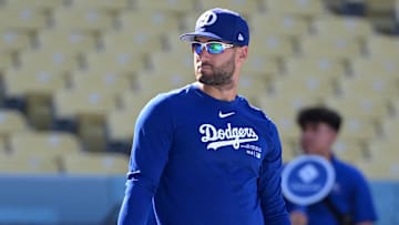 Aug 28, 2024; Los Angeles, California, USA;  Los Angeles Dodgers center fielder Kevin Kiermaier (93) warms up prior to the game against the Baltimore Orioles at Dodger Stadium. Mandatory Credit: Jayne Kamin-Oncea-Imagn Images