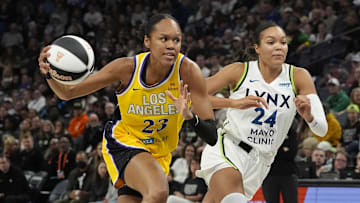 Jun 14, 2025; Minneapolis, Minnesota, USA; Los Angeles Sparks center Azurá Stevens (23) goes to the basket past Minnesota Lynx forward Napheesa Collier (24) in the first quarter at Target Center. Mandatory Credit: Bruce Kluckhohn-Imagn Images