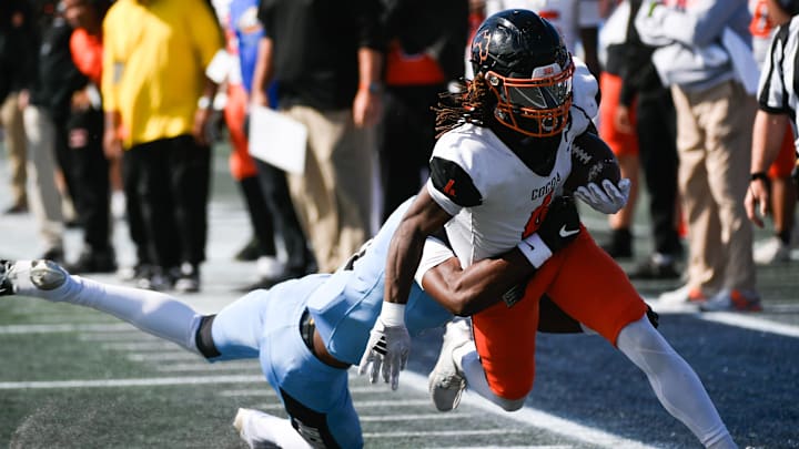 Latrison Lane of Cocoa is tackled by Daylen Green of Gadsden County in first quarter of the FHSAA football Class 2A state championship Thursday, December 12, 2024. Craig Bailey/FLORIDA TODAY via USA TODAY NETWORK