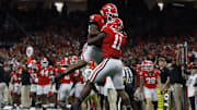Jan 2, 2025; New Orleans, LA, USA; Georgia Bulldogs linebacker Jalon Walker (11) celebrates with Bulldogs defensive lineman Mykel Williams (13) after making a defensive stop against the Notre Dame Fighting Irish during the first quarter at Caesars Superdome. Mandatory Credit: Geoff Burke-Imagn Images