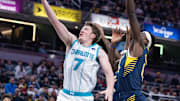 Nov 19, 2025; Indianapolis, Indiana, USA; Charlotte Hornets guard Kon Knueppel (7) shoots the ball while Indiana Pacers forward Pascal Siakam (43) defends in the first half at Gainbridge Fieldhouse. Mandatory Credit: Trevor Ruszkowski-Imagn Images