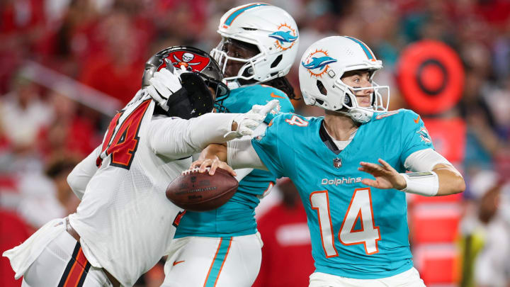 Aug 23, 2024; Tampa, Florida, USA; Tampa Bay Buccaneers defensive lineman Earnest Brown IV (74) pressures Miami Dolphins quarterback Mike White (14) in the second quarter during preseason at Raymond James Stadium.