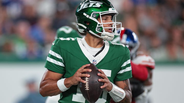 Aug 24, 2024; East Rutherford, New Jersey, USA; New York Jets quarterback Adrian Martinez drops back to pass against the New York Giants during the first half at MetLife Stadium. 