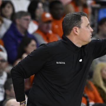 Mar 20, 2025; Providence, RI, USA; McNeese State Cowboys head coach Will Wade signals to his players  during the second half against the Clemson Tigers at Amica Mutual Pavilion. Mandatory Credit: Eric Canha-Imagn Images