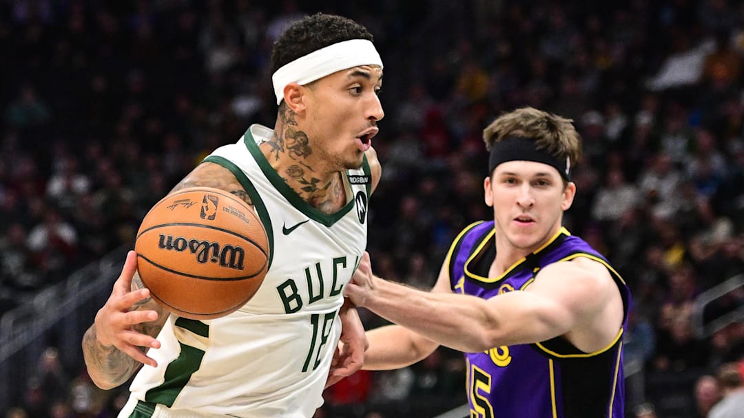 Mar 13, 2025; Milwaukee, Wisconsin, USA; Milwaukee Bucks forward Kyle Kuzma (18) drives for the basket against Los Angeles Lakers guard Austin Reaves (15) in the first quarter at Fiserv Forum. Mandatory Credit: Benny Sieu-Imagn Images Mar 13, 2025; Milwaukee, Wisconsin, USA; Milwaukee Bucks forward Kyle Kuzma (18) drives for the basket against Los Angeles Lakers guard Austin Reaves (15) in the first quarter at Fiserv Forum. Mandatory Credit: Benny Sieu-Imagn Images