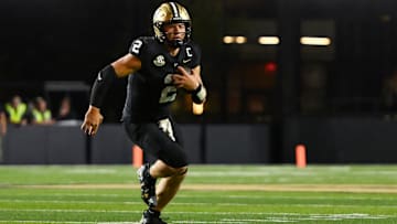 Aug 30, 2025; Nashville, Tennessee, USA;  Vanderbilt Commodores quarterback Diego Pavia (2) runs with the ball against the Charleston Southern Buccaneers during the second half at FirstBank Stadium. Mandatory Credit: Steve Roberts-Imagn Images