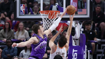 Feb 25, 2024; Salt Lake City, Utah, USA; Utah Jazz center Walker Kessler (24) blocks the shot of San Antonio Spurs forward Zach Collins (23) during the second quarter at Delta Center.