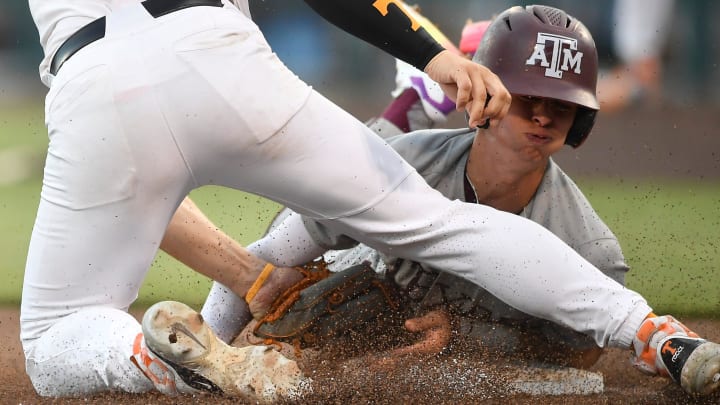 Texas A&M's Ali Camarillo (2) is tagged out at third base by Tennessee's Billy Amick (11) during a NCAA College World Series game between Tennessee and Texas A&M at Charles Schwab Field in Omaha, Neb., on Saturday, June 22, 2024.