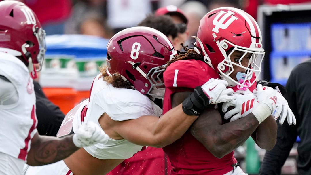Alabama Crimson Tide linebacker Justin Hill (8) works to stop Indiana Hoosiers running back Roman Hemby (1) as he rushes the ball Thursday, Jan. 1, 2026, during the Rose Bowl and quarterfinal game of the College Football Playoff at Rose Bowl Stadium in Pasadena, Calif.