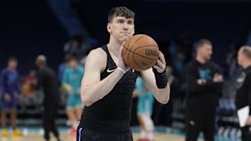 Apr 4, 2025; Charlotte, North Carolina, USA; Sacramento Kings forward Jake LaRavia (33) shoots during pregame warm ups against the Charlotte Hornets  at Spectrum Center. Mandatory Credit: Jim Dedmon-Imagn Images