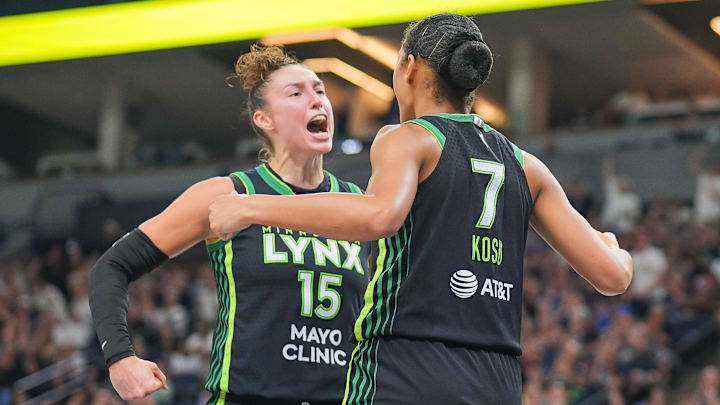 Jul 25, 2025; Minneapolis, Minnesota, USA; Minnesota Lynx forward Jessica Shepard (15) and forward Anastasiia Olairi Kosu (7) celebrate after a basket against the Las Vegas Aces in the fourth quarter at Target Center. Mandatory Credit: Brad Rempel-Imagn Images