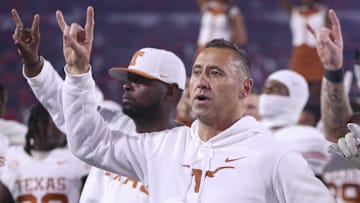Texas Longhorns coach Steve Sarkisian and team gesture after the game against the Georgia Bulldogs at Sanford Stadium in Athens, Ga.