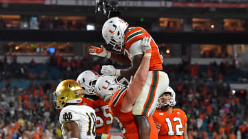 Nov 11, 2017; Miami Gardens, FL, USA; Miami Hurricanes quarterback DeeJay Dallas (13) celebrates his touchdown against the Notre Dame Fighting Irish during the second half at Hard Rock Stadium. Mandatory Credit: Jasen Vinlove-USA TODAY Sports