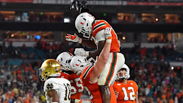Nov 11, 2017; Miami Gardens, FL, USA; Miami Hurricanes quarterback DeeJay Dallas (13) celebrates his touchdown against the Notre Dame Fighting Irish during the second half at Hard Rock Stadium. Mandatory Credit: Jasen Vinlove-Imagn Images