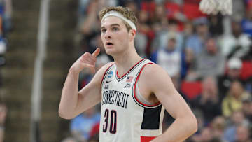 Mar 21, 2025; Raleigh, NC, USA;  Connecticut Huskies forward Liam McNeeley (30) reacts during the first half against the Oklahoma Sooners at Lenovo Center. Mandatory Credit: Zachary Taft-Imagn Images