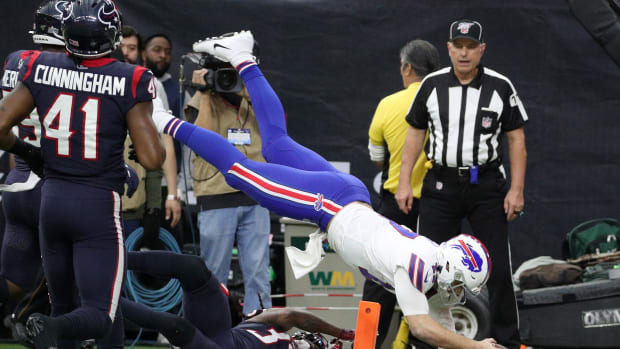 Bills quarterback Josh Allen dives into the end zone on this pass from John Brown against the Texans in the first quarter.