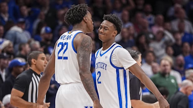 Kentucky Wildcats center Amari Williams (22) reacts with guard Jaxson Robinson (2) during the second half at State Farm Arena