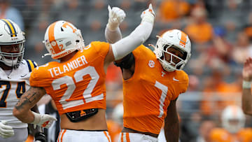 Sep 6, 2025; Knoxville, Tennessee, USA; Tennessee Volunteers linebacker Jeremiah Telander (22) and  linebacker Arion Carter (7) react to a play against the East Tennessee State Buccaneers during the second half at Neyland Stadium. Mandatory Credit: Randy Sartin-Imagn Images