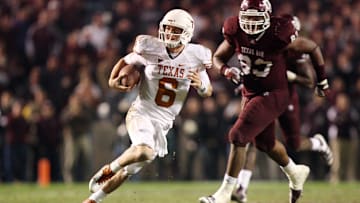 Nov 24, 2011; College Station, TX, USA; Texas Longhorns quarterback Case McCoy (6) scrambles from Texas A&M Aggies defensive lineman Tony Jerod-Eddie (83) during the second half at Kyle Field. Texas won 27-25. 