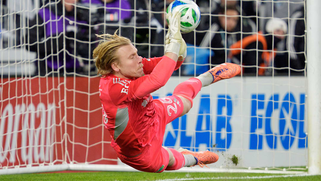 Nov 8, 2025; Saint Paul, Minnesota, USA; Seattle Sounders goalkeeper Andrew Thomas (26) gets a hand on a shot by Seattle Sounders defender Jackson Ragen (25) but it goes in anyway in the shootouts at Allianz Field. Mandatory Credit: Matt Blewett-Imagn Images