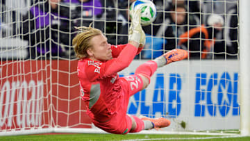 Nov 8, 2025; Saint Paul, Minnesota, USA; Seattle Sounders goalkeeper Andrew Thomas (26) gets a hand on a shot by Seattle Sounders defender Jackson Ragen (25) but it goes in anyway in the shootouts at Allianz Field. Mandatory Credit: Matt Blewett-Imagn Images