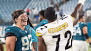 Jacksonville Jaguars defensive end Danny Striggow (92) has a laugh with Pittsburgh Steelers defensive end Esezi Otomewo (72) after the first preseason game where the Jacksonville Jaguars hosted the Pittsburgh Steelers Saturday Aug. 9, 2025, at EverBank Stadium in Jacksonville, Fla. [Doug Engle/Florida Times-Union]