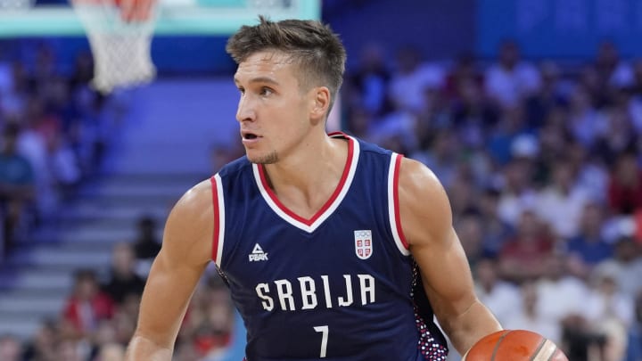 Jul 31, 2024; Villeneuve-d'Ascq, France; Serbia shooting guard Bogdan Bogdanovic (7) dribbles in the second quarter against Puerto Rico during the Paris 2024 Olympic Summer Games at Stade Pierre-Mauroy. Mandatory Credit: John David Mercer-USA TODAY Sports