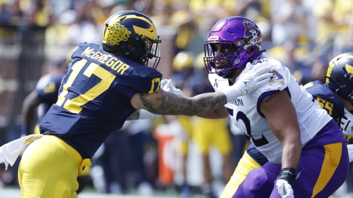 Sep 2, 2023; Ann Arbor, Michigan, USA; Michigan Wolverines defensive end Braiden McGregor (17) rushes on defense at East Carolina Pirates defensive lineman Xavier McIver (52) in the first half at Michigan Stadium.