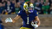 Sep 13, 2025; South Bend, Indiana, USA; Notre Dame Fighting Irish wide receiver Jaden Greathouse (1) runs with the ball during the second half against the Texas A&M Aggies at Notre Dame Stadium. 