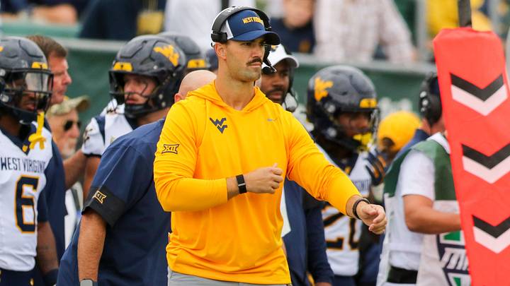 Sep 6, 2025; Athens, Ohio, USA; West Virginia Mountaineers defensive coordinator Zac Alley calls out plays from the sidelines during the first quarter against the West Virginia Mountaineers at Peden Stadium. Mandatory Credit: Ben Queen-Imagn Images